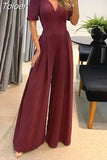 Women Jumpsuit Puff Short Sleeve V Neck Backless Nipped Waist Loose Wide Legs Casual Pants Romper High